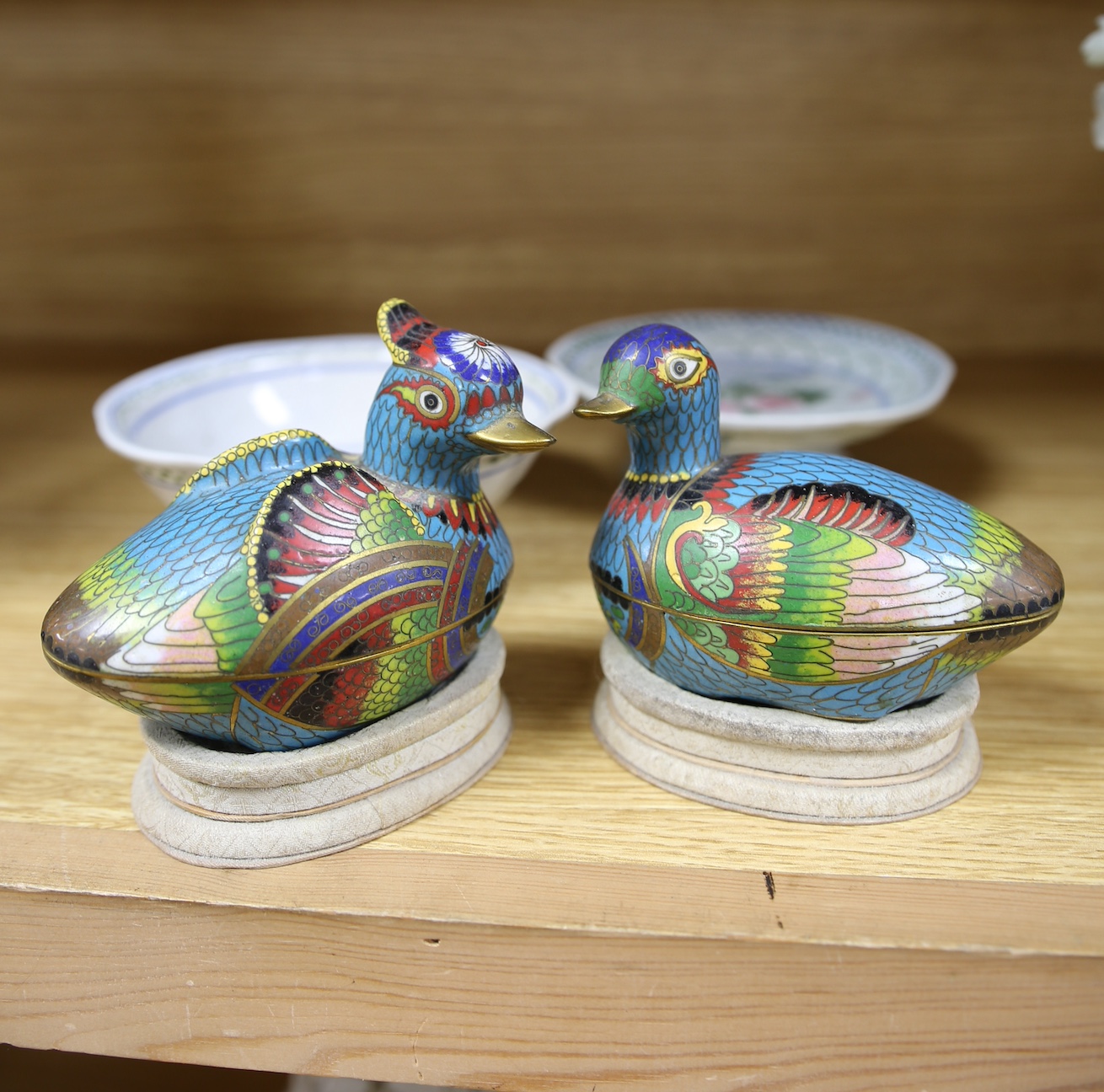 Five Chinese items including a pair of cloisonné enamel duck boxes and covers, a hardstone floral display and two dishes, largest 30cm. Condition - fair